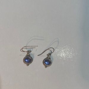 Blue stone earrings with silver finish
